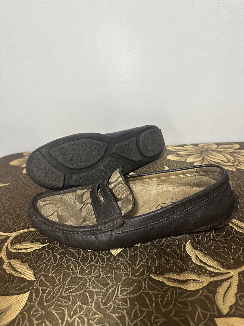 Coach Loafers (Category: Casual Shoes) located in Batangas. Submitted by jim2621 (Listing ID 1438513500, Image 2). Description: Coach loafers with signature logo pattern. Features a dark brown leather exterior with a matching sole. The interior has a Coach logo. The shoes have a classic loafer design with a slip-on style..