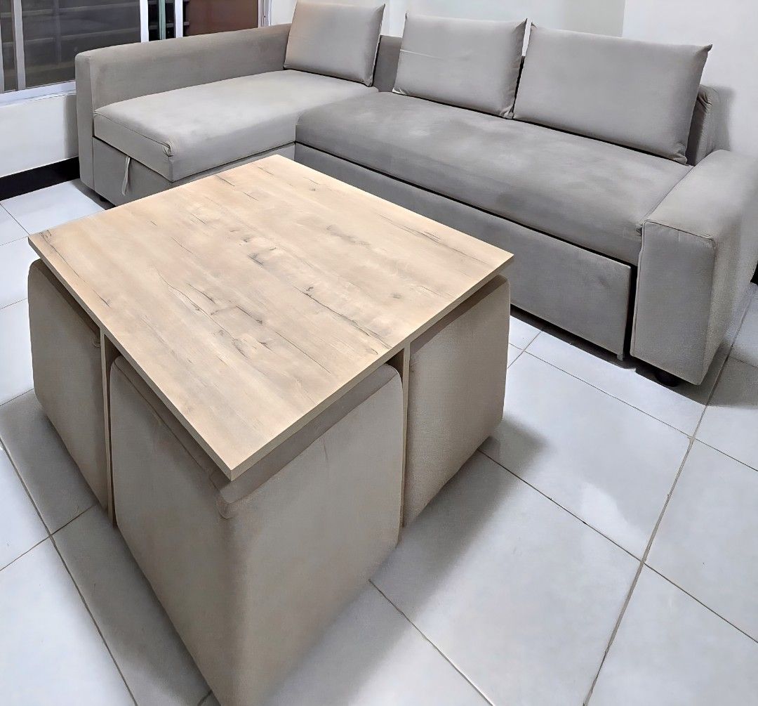 Coffee Table with Ottoman Set (Category: Tables & Sets) located in Manila. Submitted by knasun15 (Listing ID 1438615829, Image 2). Description: - Stylish coffee table with light wood-grain finish - Includes four matching ottomans - Ottomans conveniently store under the table - Neutral color complements any decor - Ideal for small spaces - Provides extra seating.