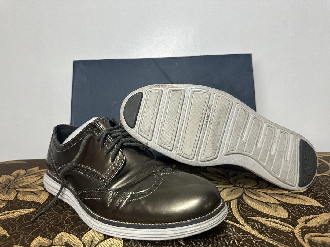 Cole Haan Wingtip Oxford Shoes (Category: Dress Shoes) located in Batangas. Submitted by jim2621 (Listing ID 1438541077, Image 2). Description: - Cole Haan wingtip oxford shoes - Metallic finish - White soles - Lace-up closure - Classic wingtip design - Includes original box - Good overall condition - Worn 3 times.