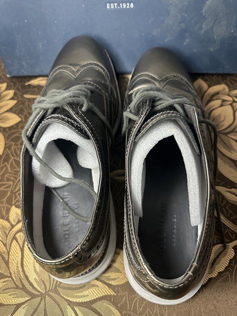Cole Haan Wingtip Oxford Shoes (Category: Dress Shoes) located in Batangas. Submitted by jim2621 (Listing ID 1438541077, Image 3). Description: - Cole Haan wingtip oxford shoes - Metallic finish - White soles - Lace-up closure - Classic wingtip design - Includes original box - Good overall condition - Worn 3 times.