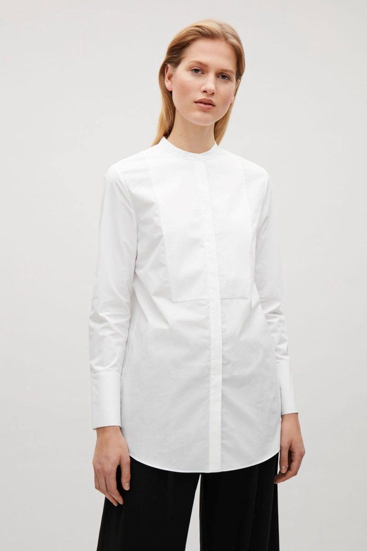 COS White Mandarin Collar Shirt (Category: Tshirts & Polo Shirts ) located in Cavite. Submitted by hand.picked (Listing ID 1438627251, Image 2). Description: - COS white long-sleeved shirt - Mandarin collar - Button-down front - Tailored fit - Buttoned cuffs - Slightly longer length - Curved hem - Versatile for various occasions Size: EU34 Fit XSmall Dimension: 20” Width / 29” Length Condition: Excellent.