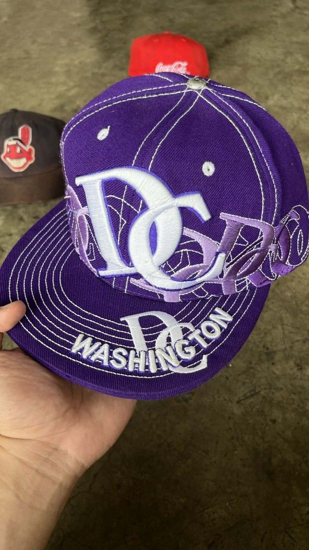 DC Washington Purple Cap (Category: Caps & Hats) located in Manila. Submitted by coolbird.e6a52c (Listing ID 1438662318, Image 1). Description: - Purple cap with white stitching - Features "DC Washington" logo - Fitted style with curved brim - Size: Medium.