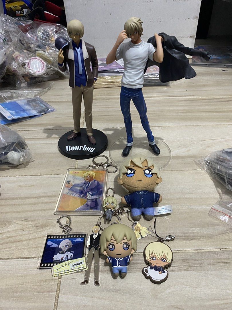 Detective Conan Bourbon and Amuro Figures and Keychains (Category: Vintage Collectibles) located in Manila. Submitted by jusstoys.phil (Listing ID 1438535726, Image 1). Description: - Detective Conan merchandise featuring Bourbon and Amuro. - Includes: - Two figurines (Bourbon in suit, Amuro in jacket) - Several keychains with various Amuro designs - One plush keychain - Great for Detective Conan fans!.