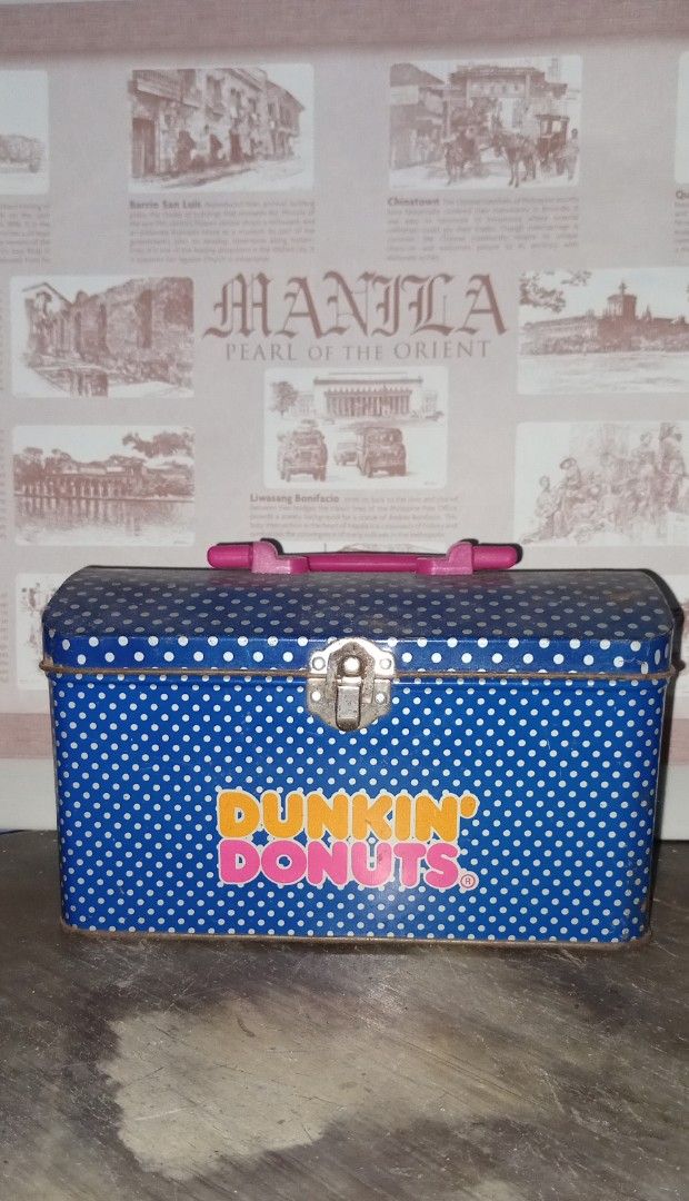 Vintage Dunkin' Donuts Lunch Box Set (Category: Food Organization & Storage) located in Manila. Submitted by iamrich110502 (Listing ID 1438595687, Image 3). Description: - Vintage Dunkin' Donuts lunch box - Features camouflage and blue polka dot designs - Includes a handle for easy carrying - Secure clasp closure - Perfect for collectors and Dunkin' Donuts fans!.