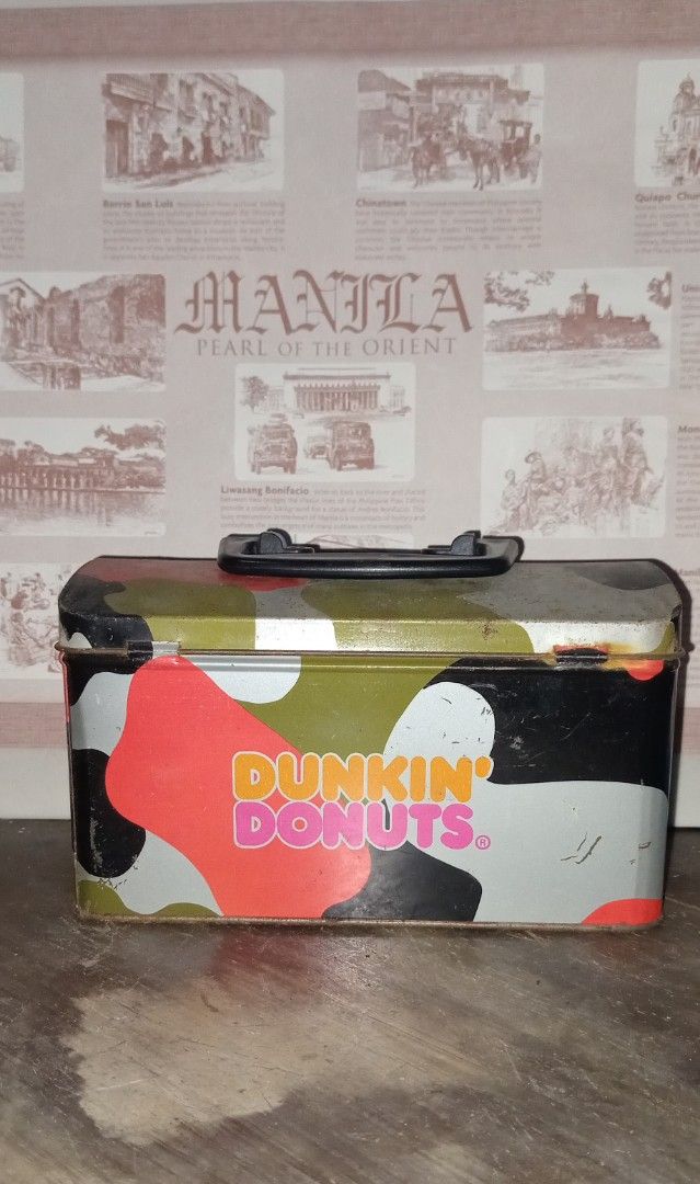 Vintage Dunkin' Donuts Lunch Box Set (Category: Food Organization & Storage) located in Manila. Submitted by iamrich110502 (Listing ID 1438595687, Image 2). Description: - Vintage Dunkin' Donuts lunch box - Features camouflage and blue polka dot designs - Includes a handle for easy carrying - Secure clasp closure - Perfect for collectors and Dunkin' Donuts fans!.