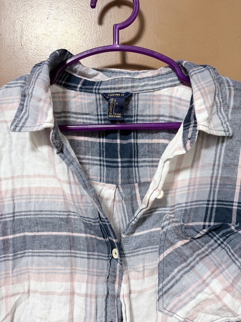 F21 Plaid Flannel/Cover-up/Oversized Longsleevee (Category: Shirts) located in Meycauayan. Submitted by _cbear (Listing ID 1438529205, Image 2). Description: - S to Medium - Very soft and presko - plaid shirt - Rfs: Decluttering, No Flaws , Needs Ironing - Relaxed fit - Oversized long sleeves - Collared neckline - Long sleeves - Single chest pocket - Button-down closure - Curved hemline - Plaid pattern: white, blue, and pink - Perfect for casual 