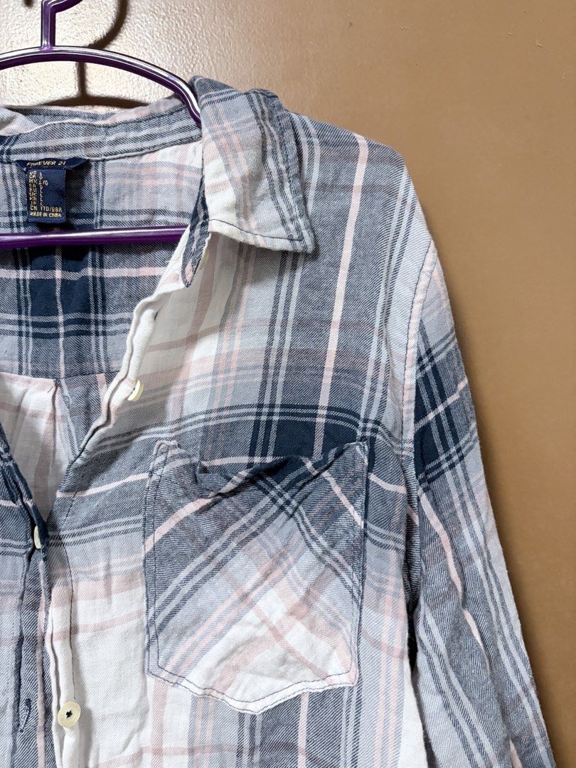 F21 Plaid Flannel/Cover-up/Oversized Longsleevee (Category: Shirts) located in Meycauayan. Submitted by _cbear (Listing ID 1438529205, Image 3). Description: - S to Medium - Very soft and presko - plaid shirt - Rfs: Decluttering, No Flaws , Needs Ironing - Relaxed fit - Oversized long sleeves - Collared neckline - Long sleeves - Single chest pocket - Button-down closure - Curved hemline - Plaid pattern: white, blue, and pink - Perfect for casual 