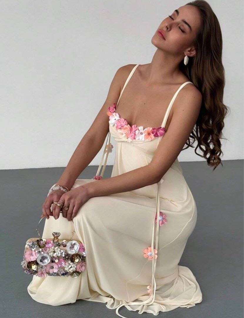 Floral Embellished Maxi Dress (Category: Dresses) located in Cavite. Submitted by gccwardrobe (Listing ID 1438559986, Image 1). Description: - Cream maxi dress - Delicate floral embellishments - Spaghetti straps - Flowing silhouette - Perfect for special occasions - USED ONCE.