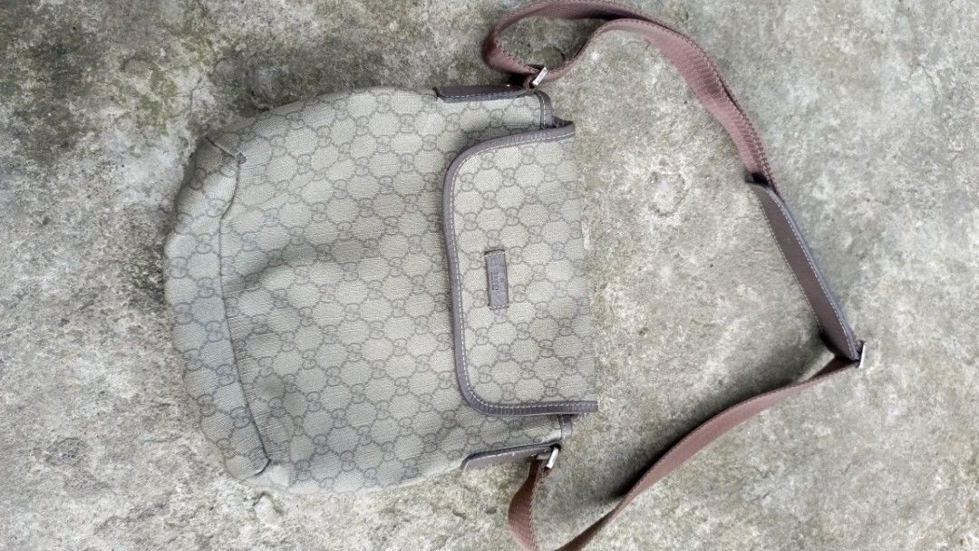Gucci GG Supreme Messenger Bag (Category: Luxury Bags & Wallets) located in Kidapawan. Submitted by rawvibe-93 (Listing ID 1438569852, Image 1). Description: - Authentic Gucci messenger bag - Iconic GG Supreme canvas - Brown leather strap and trim - Interior tag with Gucci logo and 'Made in Italy' - Serial number: 110943 107750 - Flap closure - Brown shoulder strap.