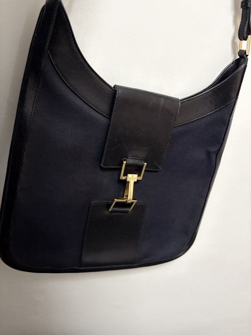 Gucci Jackie 1961 Shoulder Bag Black (Category: Luxury Bags & Wallets) located in Tanza. Submitted by iamdhana (Listing ID 1438573129, Image 2). Description: Slightly negotiable Bought in Japan Coded No major issues The inside is very clean just minor scratches we expect with vintage bags. - Gucci shoulder bag - Black fabric body - Leather trim and strap - Signature Gucci clasp - Gucci monogram lining - Gold-tone hardware - Classic and elegant de