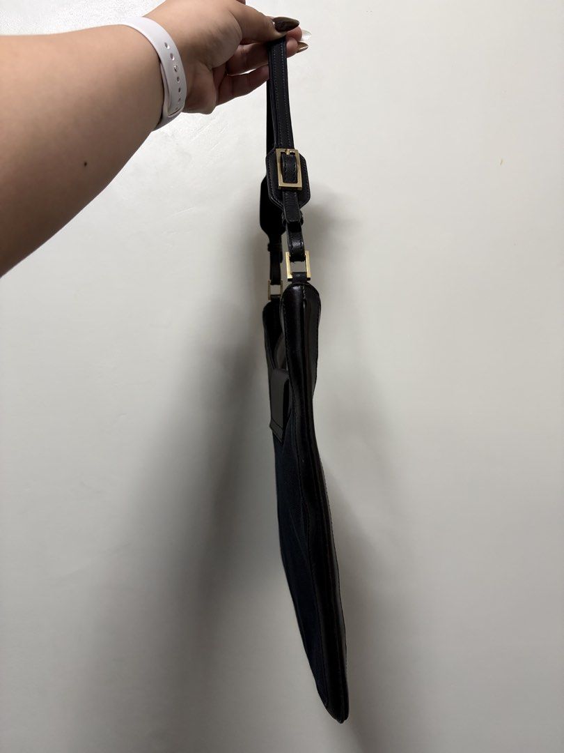 Gucci Jackie 1961 Shoulder Bag Black (Category: Luxury Bags & Wallets) located in Tanza. Submitted by iamdhana (Listing ID 1438573129, Image 3). Description: Slightly negotiable Bought in Japan Coded No major issues The inside is very clean just minor scratches we expect with vintage bags. - Gucci shoulder bag - Black fabric body - Leather trim and strap - Signature Gucci clasp - Gucci monogram lining - Gold-tone hardware - Classic and elegant de