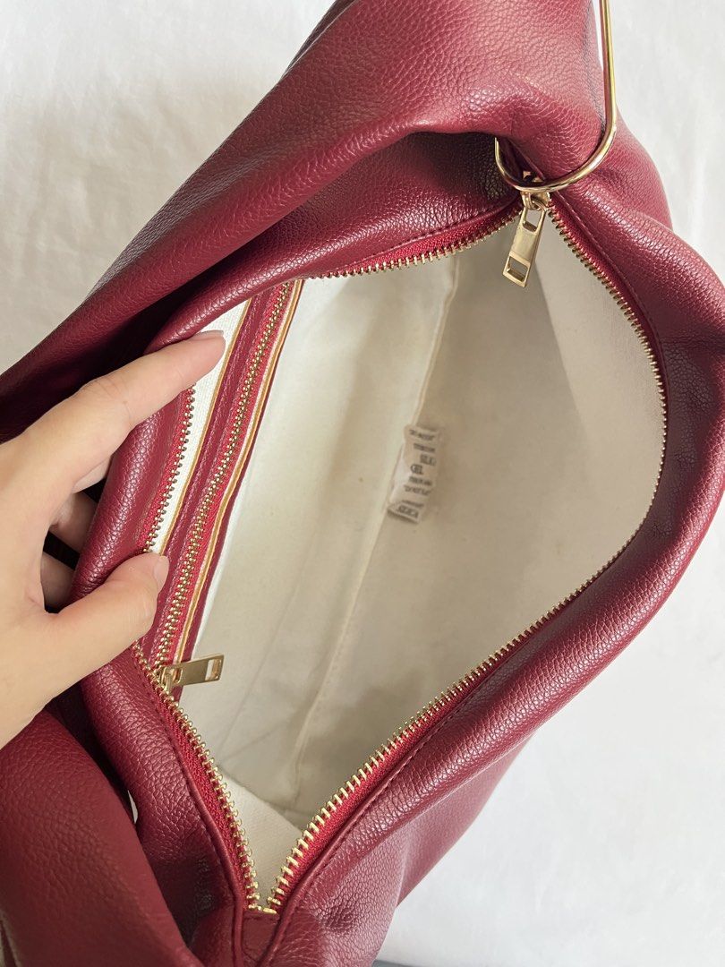 GVN Medium Hobo Bag (Burgundy) (Category: Shoulder Bags) located in Manila. Submitted by jazzisells (Listing ID 1438539258, Image 2). Description: - gvn hobo bag medium (burgundy) - w/ carabiner - still in good condition with minimal peeling - rfs: decluttering .