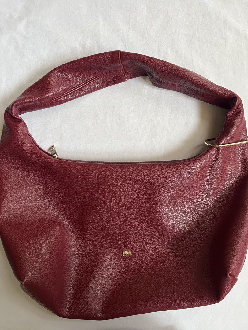 GVN Medium Hobo Bag (Burgundy) (Category: Shoulder Bags) located in Manila. Submitted by jazzisells (Listing ID 1438539258, Image 1). Description: - gvn hobo bag medium (burgundy) - w/ carabiner - still in good condition with minimal peeling - rfs: decluttering .