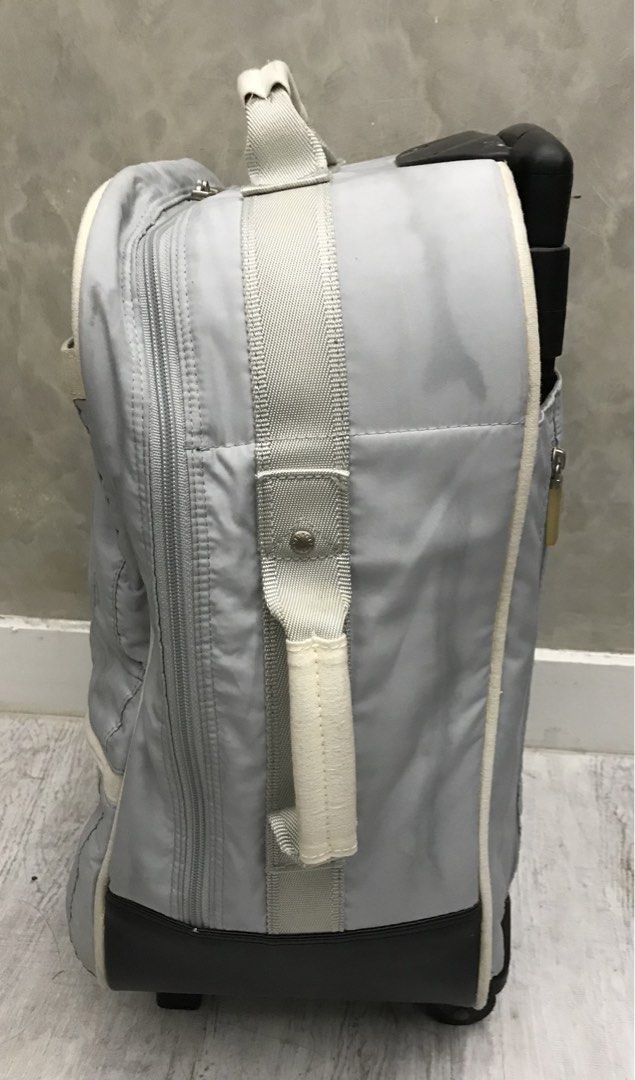 Hand Carry Luggage (Category: Luggage) located in Quezon City. Submitted by 79moving (Listing ID 1438514863, Image 3). Description: Light gray 2 wheeler Issue: zipper handle(last picture) Used..