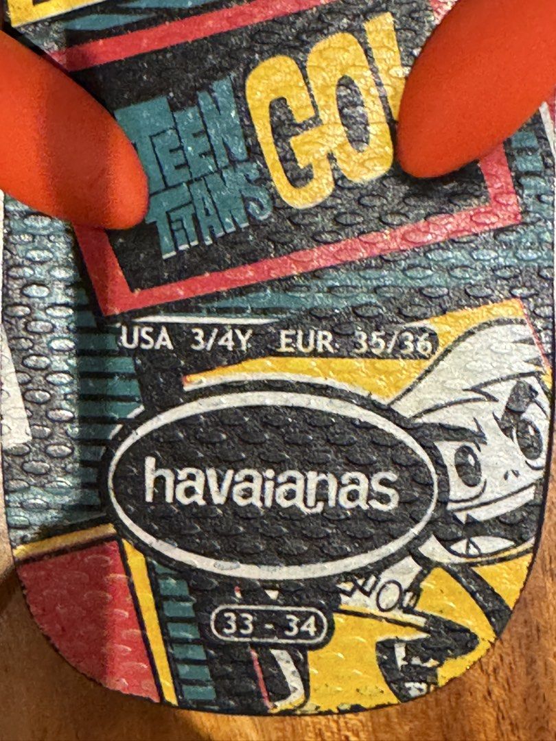 Havaianas Teen Titans Flip-Flops - Size EU 35-36 (Category: Babies & Kids Fashion) located in Singapore. Submitted by virginialap (Listing ID 1438553935, Image 2). Description: - Havaianas flip-flops Teen Titans design - Size: 3/4Y (EUR 35/36) - Colour: Red straps, black sole - Condition: Great .
