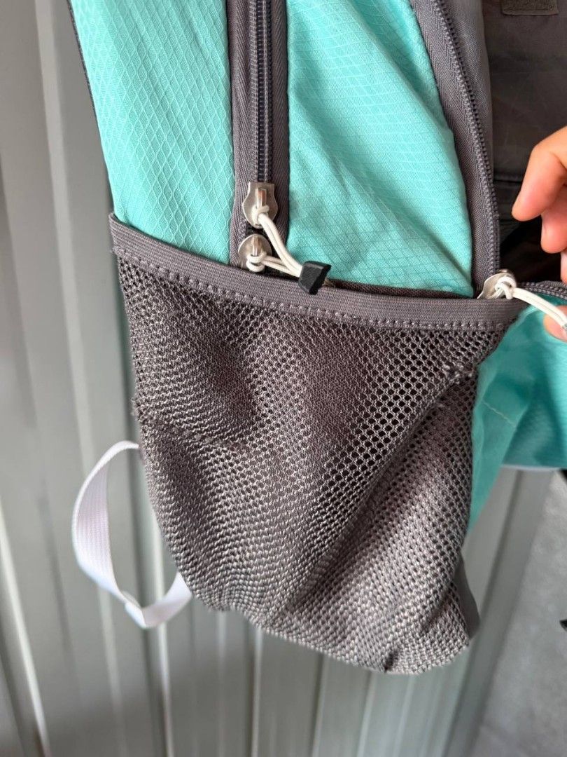 High Sierra Backpack (Category: Backpacks) located in Rosales. Submitted by c0lby3 (Listing ID 1438603917, Image 3). Description: - High Sierra backpack - Teal and gray color scheme - Multiple compartments for storage - Main compartment and front pocket - Side mesh pockets - Padded shoulder straps - Padded back panel - High Sierra logo.