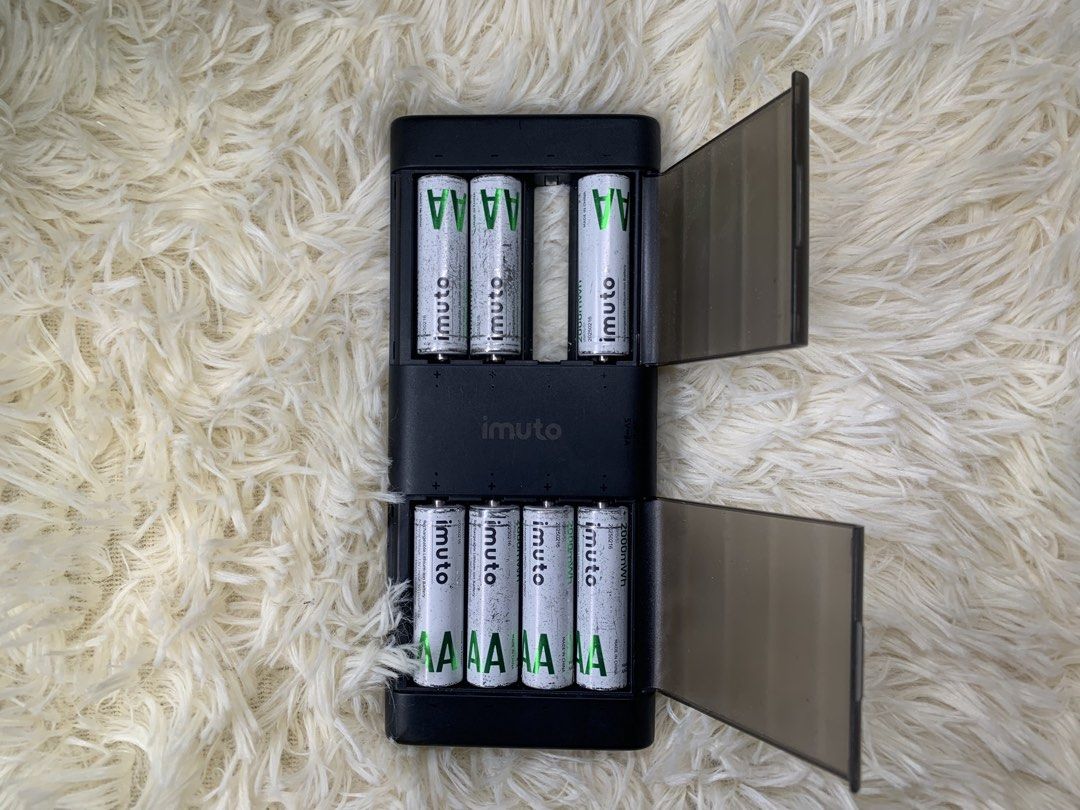 Imuto AA Battery Charger (w 7 pcs Battery) (Category: Chargers & Cables) located in Marikina City. Submitted by seetheandburn (Listing ID 1438508280, Image 2). Description: - Imuto AA battery charger included. - Comes with 7 AA 1000mAh batteries. - Black charger casing with a clear cover. - Designed for AA batteries..