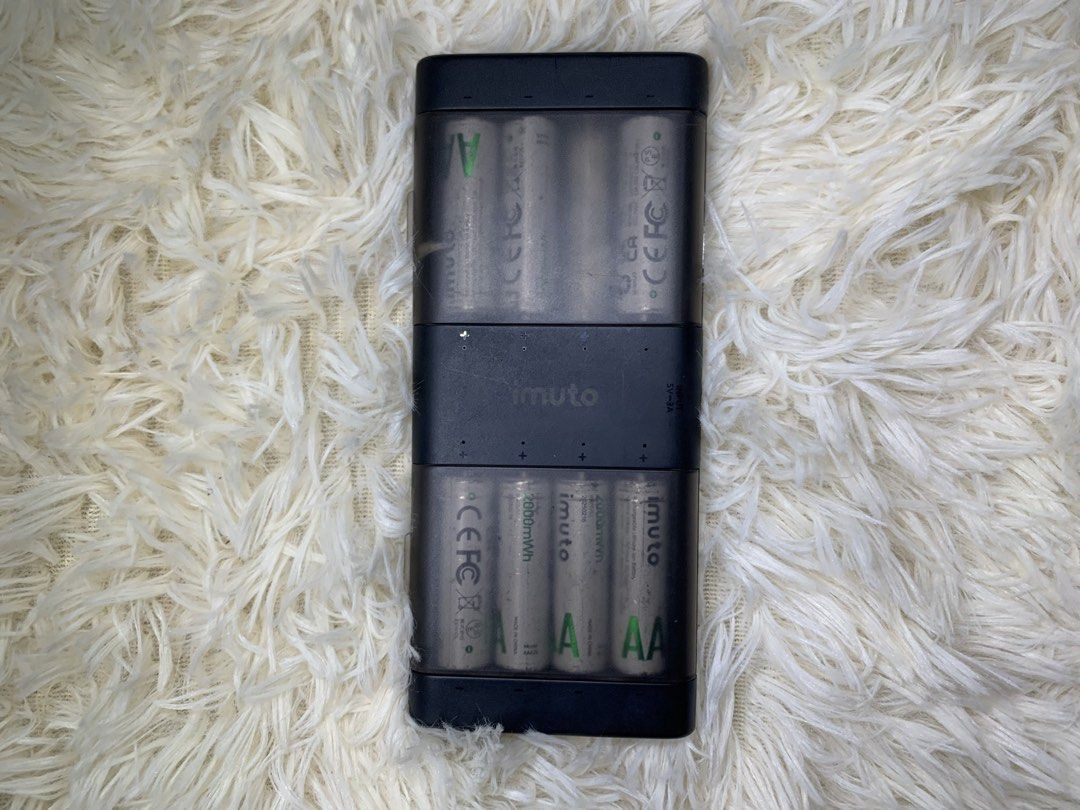 Imuto AA Battery Charger (w 7 pcs Battery) (Category: Chargers & Cables) located in Marikina City. Submitted by seetheandburn (Listing ID 1438508280, Image 1). Description: - Imuto AA battery charger included. - Comes with 7 AA 1000mAh batteries. - Black charger casing with a clear cover. - Designed for AA batteries..