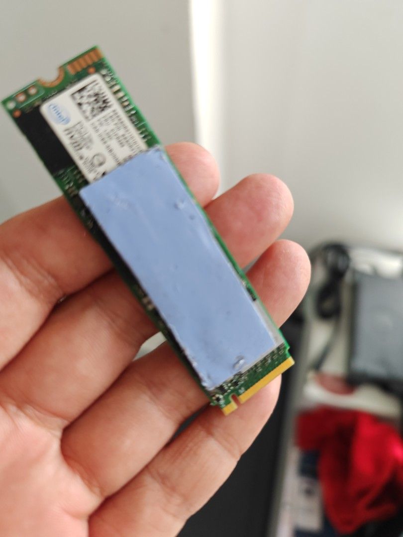 Intel 512GB NVMe SSD no issue ready to use (Category: Computer Parts) located in Quezon City. Submitted by gadgetsun (Listing ID 1438620670, Image 1). Description: - Intel 512GB NVMe SSD - Made in Taiwan - Model: SSDSC21101N1PT9A307LT - Includes a blue thermal pad.