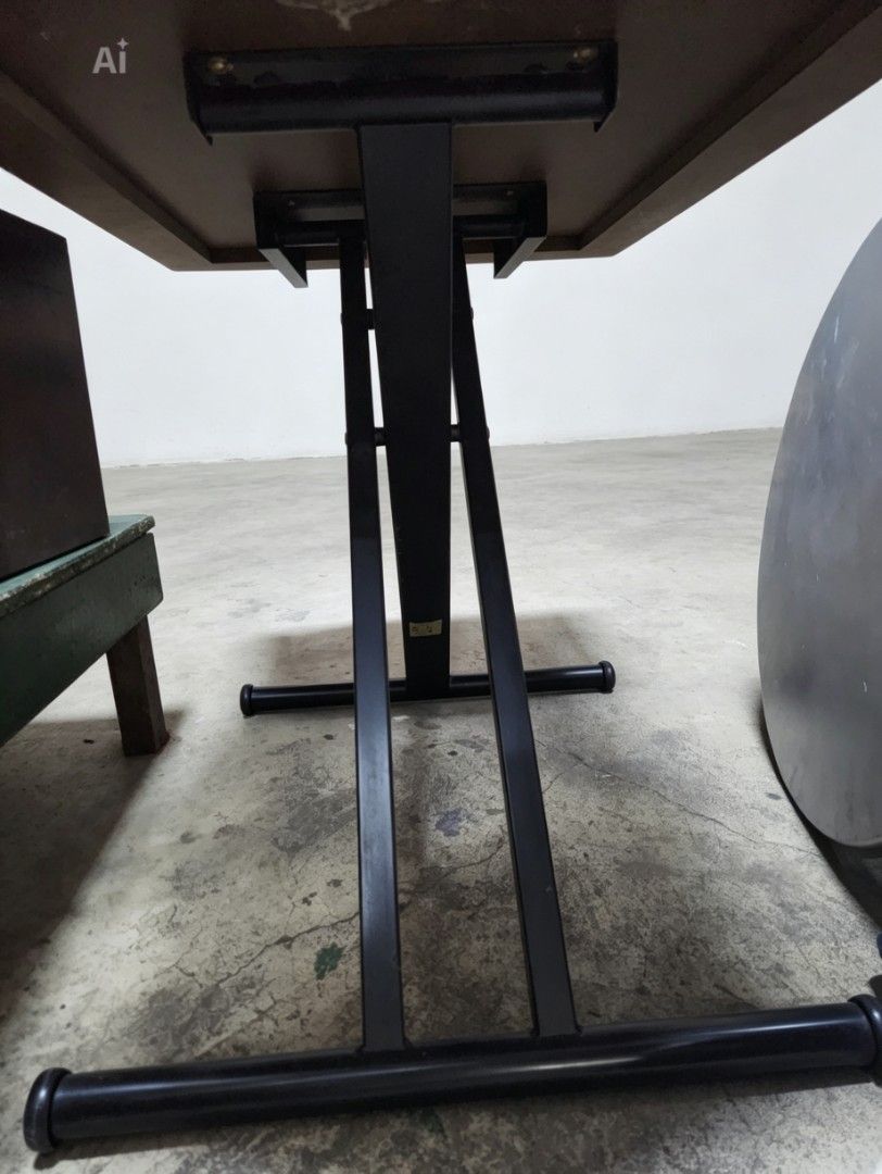 Japan surplus folding table (Category: Tables & Sets) located in Quezon City. Submitted by amber___18 (Listing ID 1438613540, Image 3). Description: - Dark wood-grain surface - Black metal frame - Adjustable height - Unique shape with rounded edges - Sturdy base for stability - Versatile design.