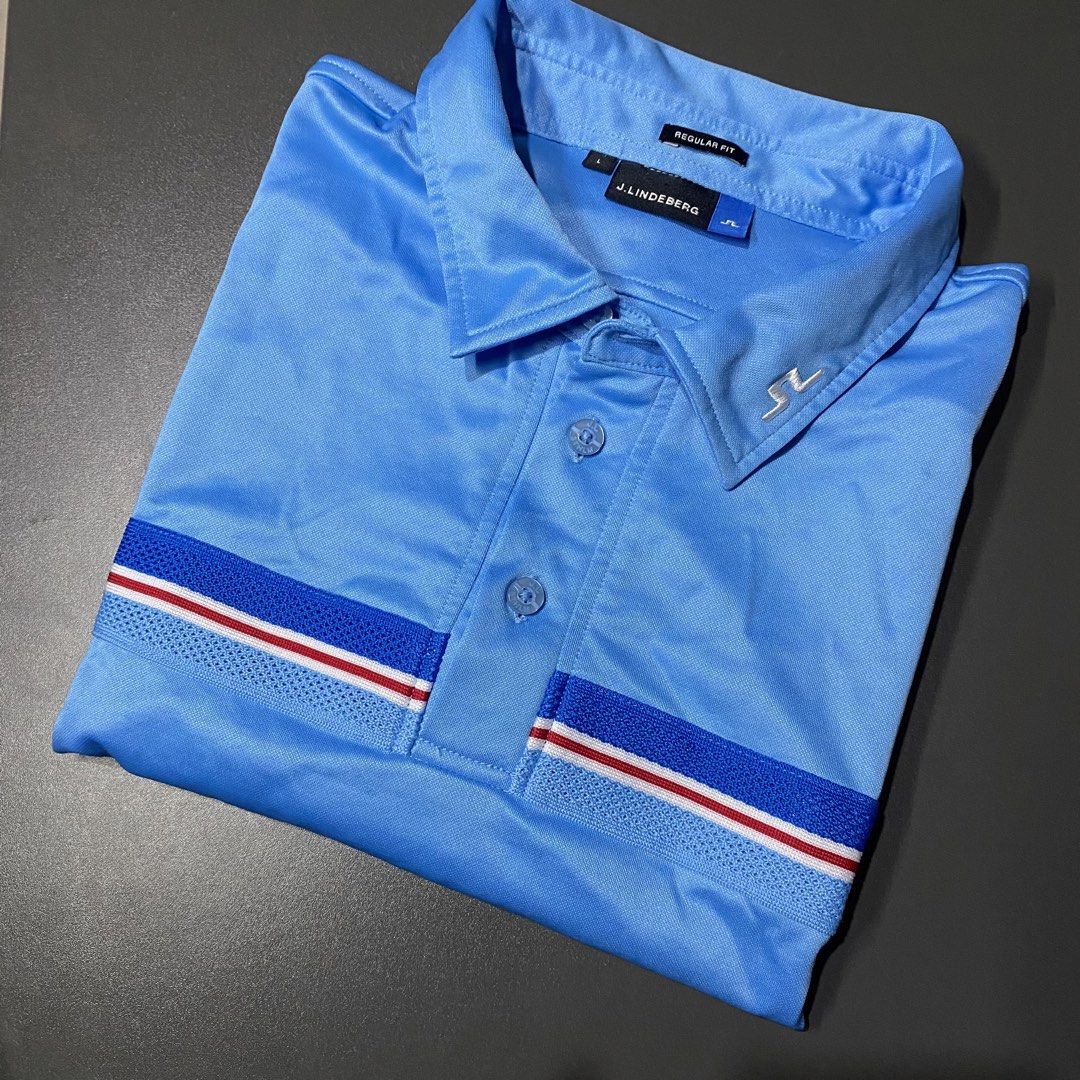 j.lindeberg Regular Fit Polo Shirt (Category: Tshirts & Polo Shirts ) located in Tagum. Submitted by johntams_ (Listing ID 1438547068, Image 1). Description: - J.Lindeberg polo shirt - Light blue color - Regular fit - Classic polo collar - Three-button placket - Sleeve design with blue, white, and red stripes - J.Lindeberg logo detail _CAN FIR MEDIUM TO LARGE (21x28.