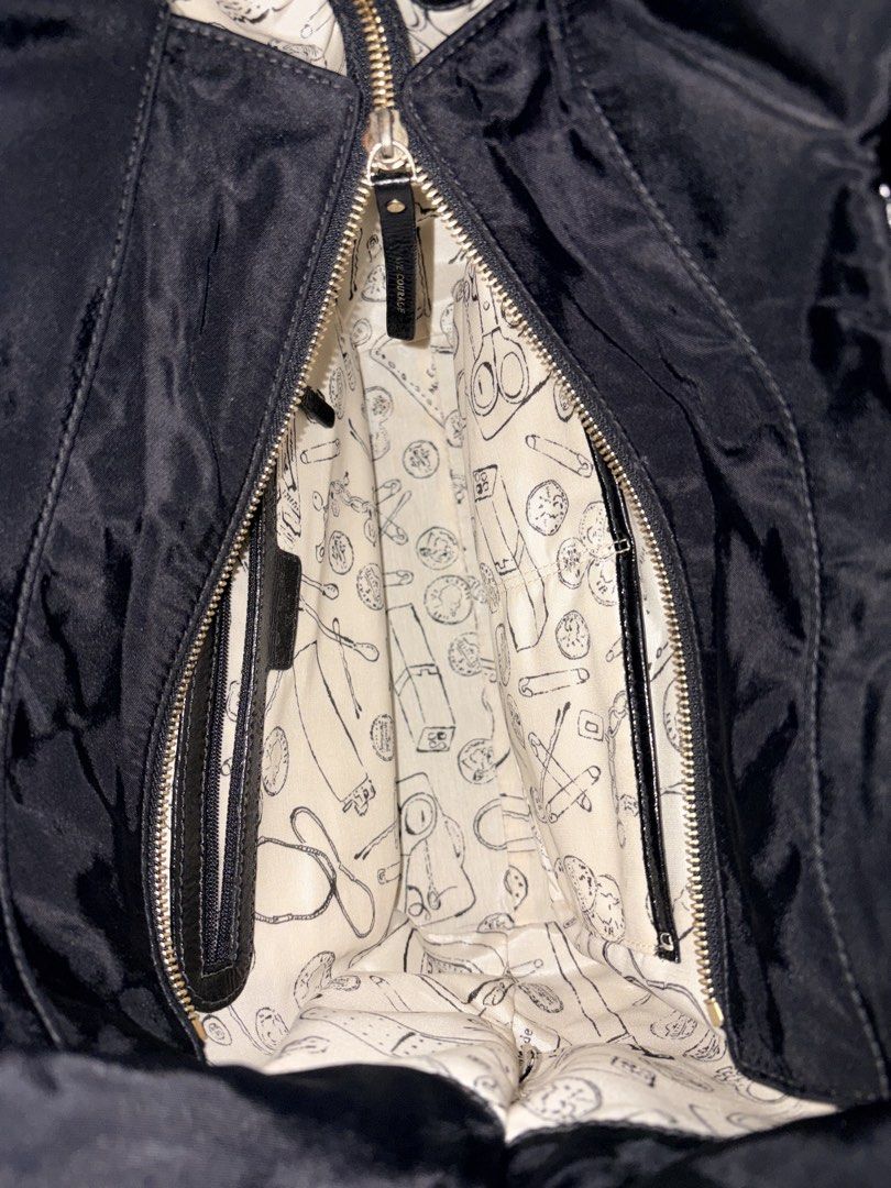 Kate Spade Black Tote Bag (Category: Tote Bags) located in Manila. Submitted by love.hazey (Listing ID 1438637133, Image 3). Description: - Kate Spade black tote bag - Large bow detail on front - Patterned interior lining - Interior zippered pocket - Exterior Kate Spade label - Shoulder strap - Zippered closure.