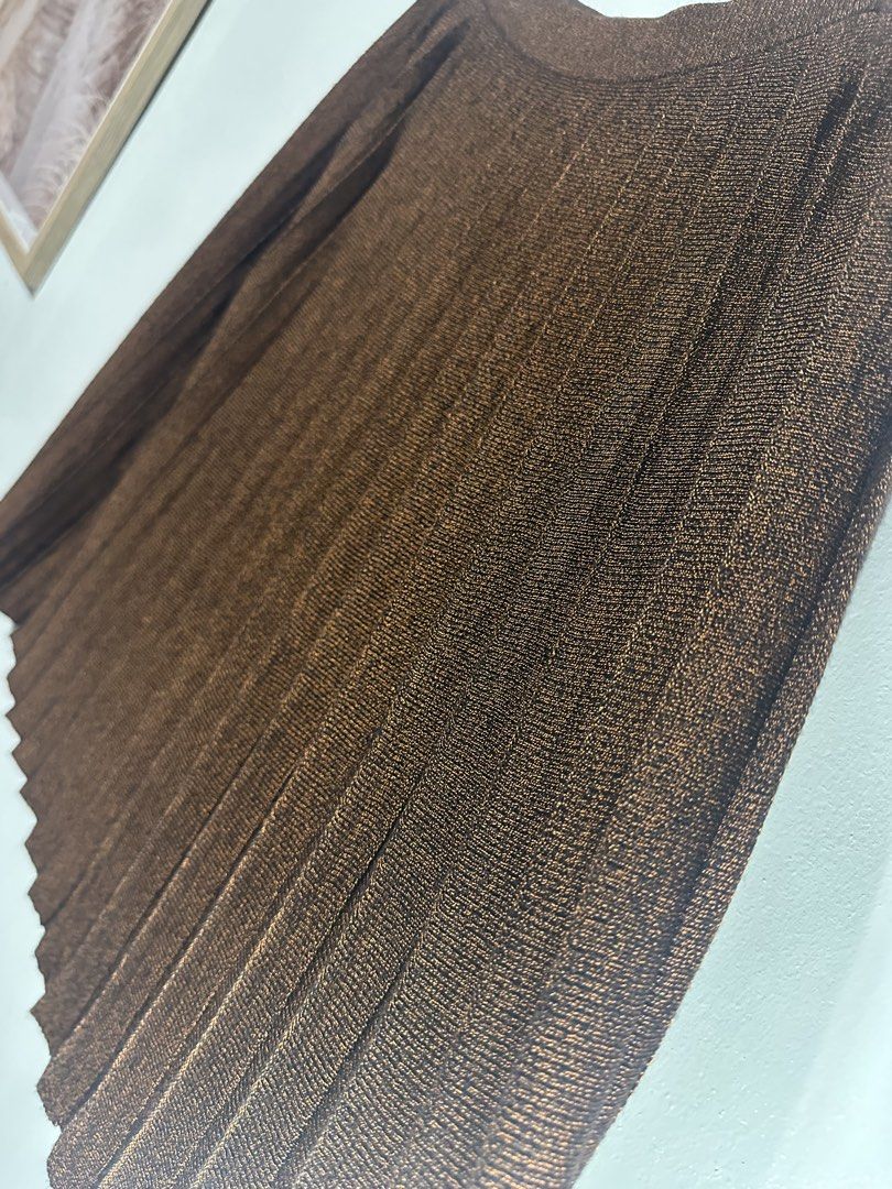 Kenzo Pleated Brown Skirt (Category: Skirts) located in Batangas. Submitted by jim2621 (Listing ID 1438625668, Image 2). Description: - Brown pleated skirt - Asymmetrical hemline - Subtle sheen - Versatile style - Fits medium.