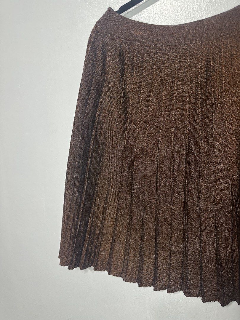 Kenzo Pleated Brown Skirt (Category: Skirts) located in Batangas. Submitted by jim2621 (Listing ID 1438625668, Image 3). Description: - Brown pleated skirt - Asymmetrical hemline - Subtle sheen - Versatile style - Fits medium.