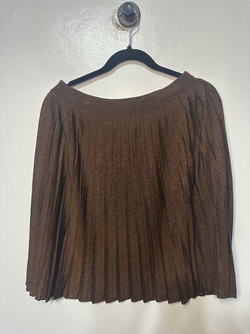 Kenzo Pleated Brown Skirt (Category: Skirts) located in Batangas. Submitted by jim2621 (Listing ID 1438625668, Image 1). Description: - Brown pleated skirt - Asymmetrical hemline - Subtle sheen - Versatile style - Fits medium.