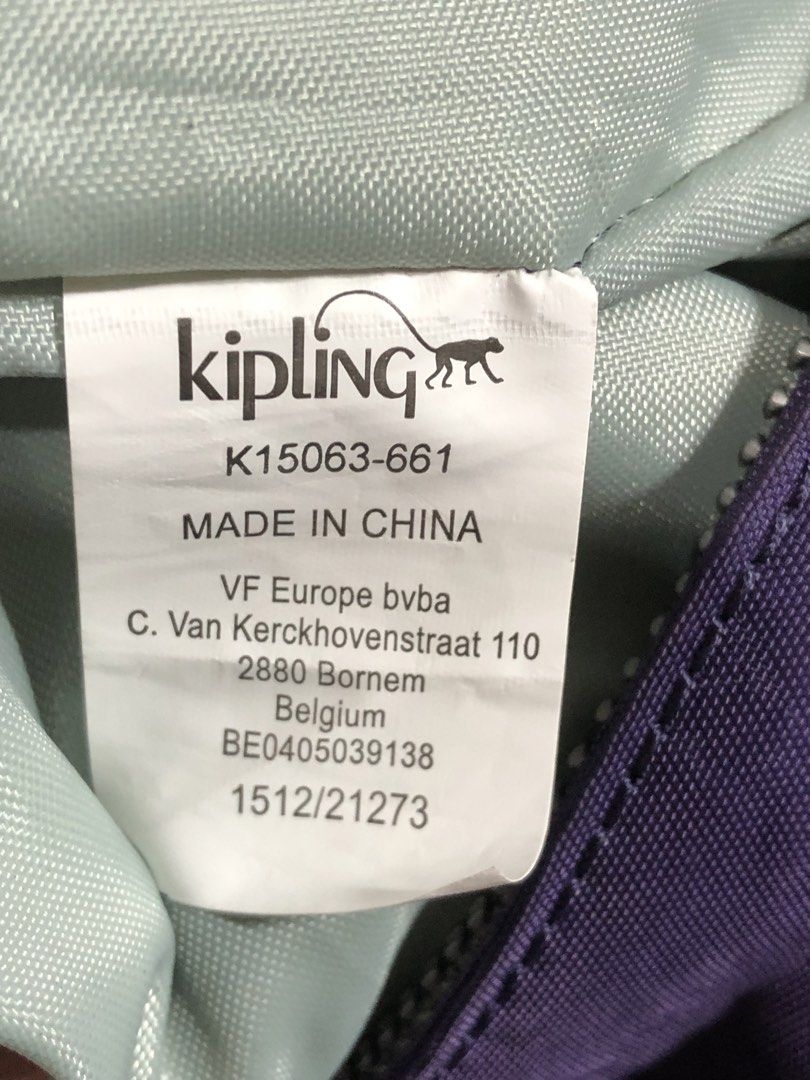 Kipling Purple Shoulder Bag K15063-661 (Category: Shoulder Bags) located in Montevista. Submitted by rdthriftshub (Listing ID 1438691240, Image 3). Description: - Authentic Kipling shoulder bag - Vibrant purple color - Zip closure - Adjustable strap - Includes signature Kipling monkey charm - Model number: K15063-661 - Made in China - Features front flap pocket and main compartment - Ideal for everyday use.