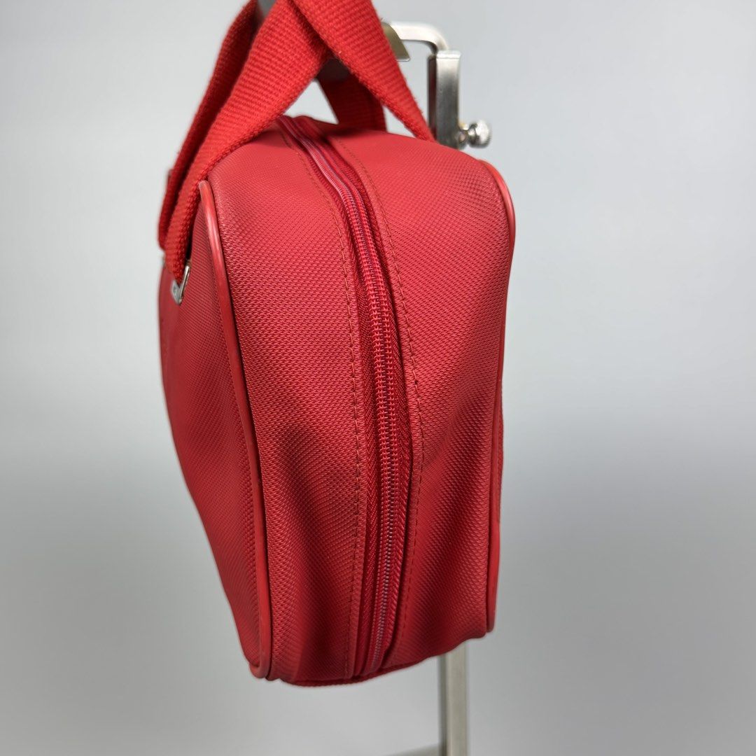 Lacoste - Red Synthetic Leather Mini Handbag (Category: Luxury Bags & Wallets) located in Quezon City. Submitted by japon_rose (Listing ID 1438664599, Image 3). Description: FOR SALE: GUARANTEED AUTHENTIC ❗️ Lacoste - Red Synthetic Leather Mini Handbag Dimensions: Length: 6 Width: 9 Side: 3.5 Under: 3.5 Handle drop: 3 (MEASURED IT BY INCHES) Condition: Can passed to 9.5/10 overall condition no scratches on corners and also no holes. Still in exce