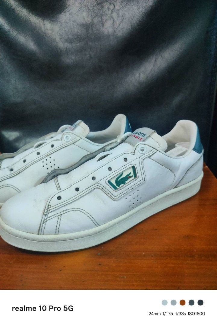 Lacoste Tennis Shoes (Category: Sneakers) located in Manila. Submitted by cleverturtle-2982 (Listing ID 1438620368, Image 3). Description: - White Lacoste Tennis shoes - Features the iconic Lacoste logo - Green accent on the heel - "Lacoste Tennis" branding on the tongue - White sole.