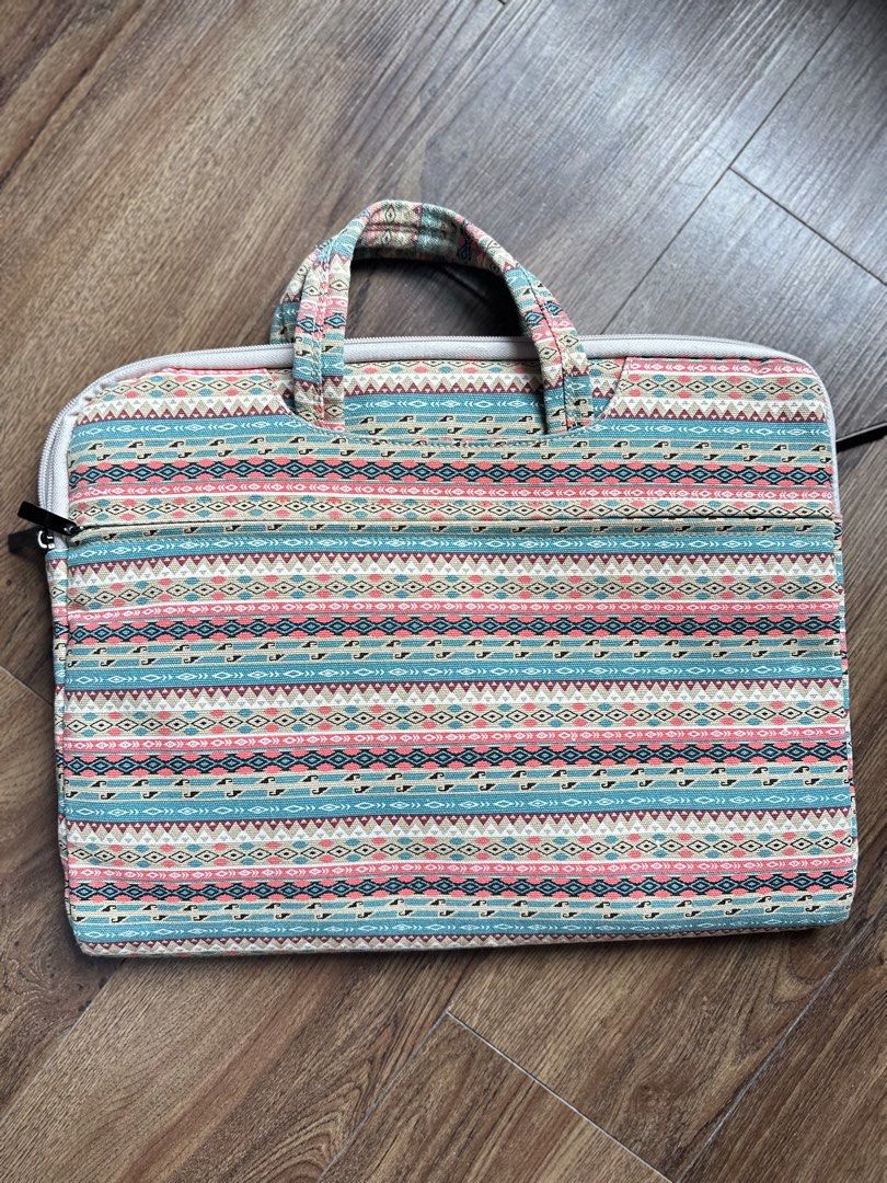 Laptop Bag, Padded Case with Handle (Category: Laptop Bags & Sleeves) located in Mandaluyong City. Submitted by TheWeekendProject (Listing ID 1438561596, Image 2). Description: - Colorful patterned exterior - Soft, protective brown interior - Secure zipper closure - Can fit up to 15-16 inches laptop - Includes an additional compartment - Convenient handle for carrying - See last photo for price reference.