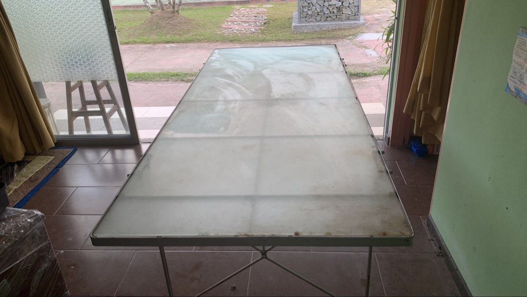 Large Rectangular Table (Category: Tables & Sets) located in Kuala Lumpur. Submitted by onekl (Listing ID 1438663325, Image 3). Description: - Rectangular table - Size : 78.5 inch x 33.5 inch - Height: 27.5 inch - Metal frame - Frosted glass top - Simple design, sturdy base - Versatile use: dining or workspace - Disassembled for easy transport.