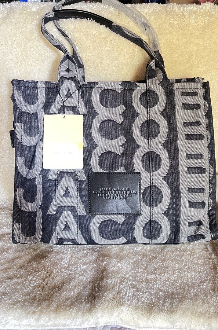 Large Tote (Category: Luxury Bags & Wallets) located in Quezon City. Submitted by smartysmart (Listing ID 1438678560, Image 1). Description: Original bought in US🇺🇸 Extra Large size ideal for traveling almost black but the says it’s blue denim Zipper closure Unique design .