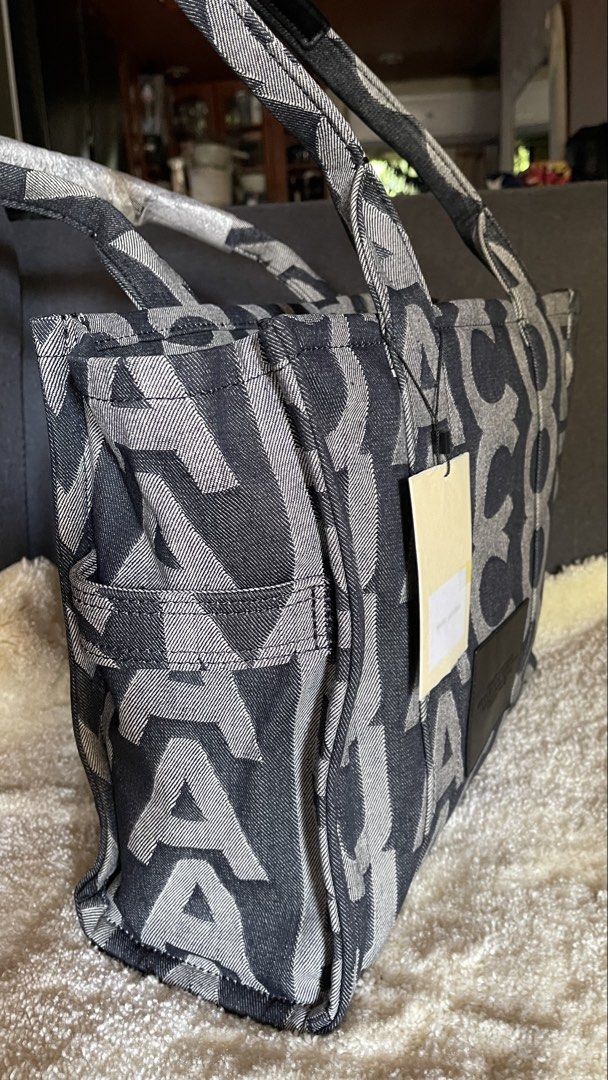 Large Tote (Category: Luxury Bags & Wallets) located in Quezon City. Submitted by smartysmart (Listing ID 1438678560, Image 2). Description: Original bought in US🇺🇸 Extra Large size ideal for traveling almost black but the says it’s blue denim Zipper closure Unique design .