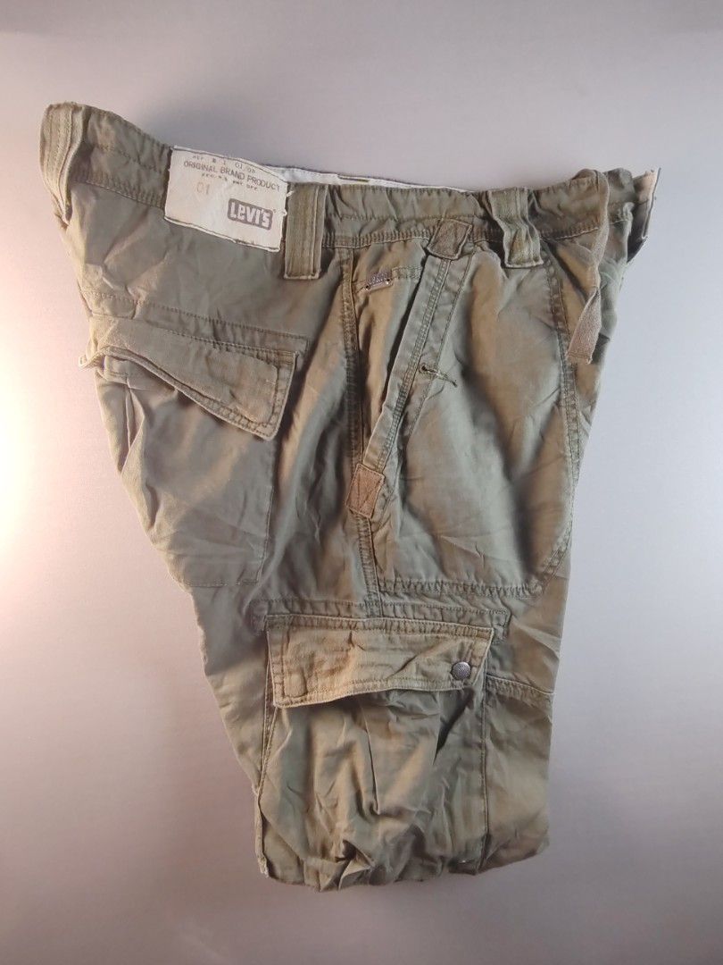 Levi's Cargo Pants (Category: Jeans) located in Manila. Submitted by carlitorep57860 (Listing ID 1438581693, Image 1). Description: - Authentic Levi's cargo pants - Classic cargo design - Multiple pockets - Lot number: 331-1155 - Color: Solid (likely olive green) - Brand: Levi Strauss & Co. - Size: Not indicated.