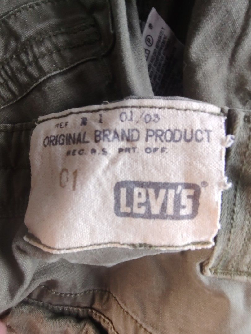 Levi's Cargo Pants (Category: Jeans) located in Manila. Submitted by carlitorep57860 (Listing ID 1438581693, Image 3). Description: - Authentic Levi's cargo pants - Classic cargo design - Multiple pockets - Lot number: 331-1155 - Color: Solid (likely olive green) - Brand: Levi Strauss & Co. - Size: Not indicated.