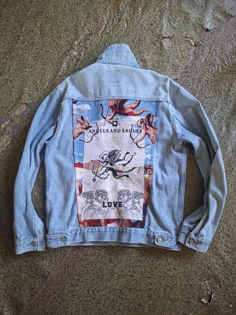 Light wash denim jacket with Cherubim emnroid (Category: Coats, Jackets and Outerwear) located in Tuburan. Submitted by kimoii (Listing ID 1438513047, Image 1). Description: size:21W×26L no issue.