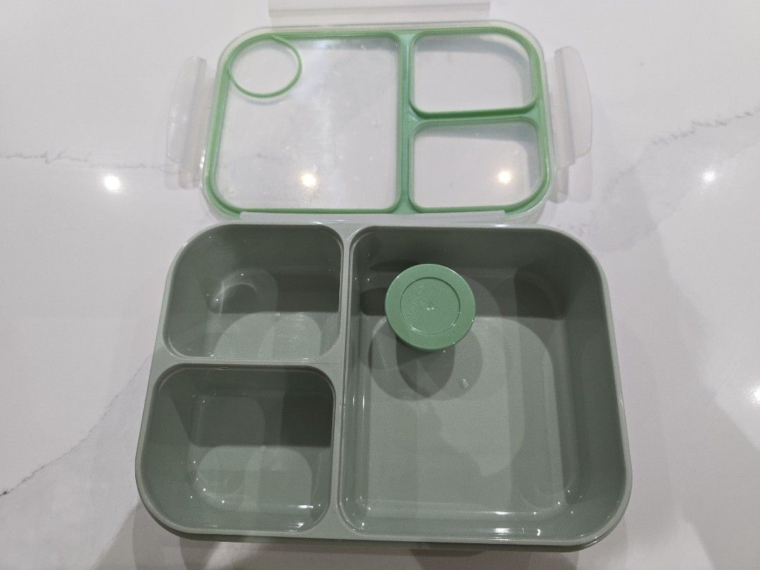 LocknLock Lunch Box with Compartments (Category: Food Organization & Storage) located in Quezon City. Submitted by warm.happylife (Listing ID 1438626159, Image 2). Description: - LocknLock lunch box 1.5L - Multiple compartments for organized meals - Green lid and base with clear top - Includes a small container with lid - Ideal for school or work lunches.
