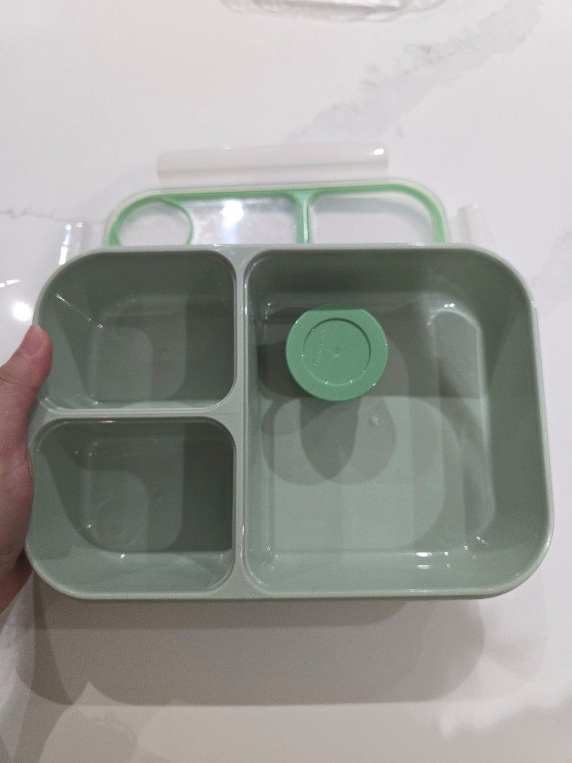 LocknLock Lunch Box with Compartments (Category: Food Organization & Storage) located in Quezon City. Submitted by warm.happylife (Listing ID 1438626159, Image 1). Description: - LocknLock lunch box 1.5L - Multiple compartments for organized meals - Green lid and base with clear top - Includes a small container with lid - Ideal for school or work lunches.