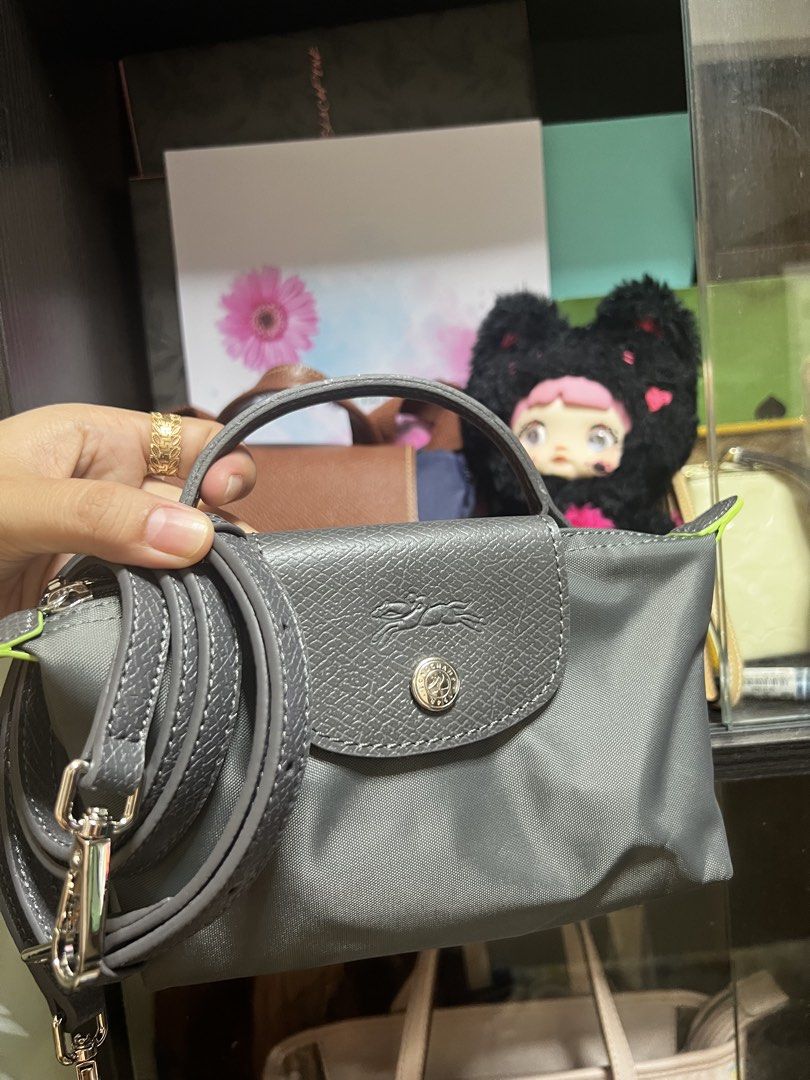 Longchamp Le Pliage Top Handle Bag (Category: Luxury Bags & Wallets) located in Caloocan City. Submitted by ericavi_g (Listing ID 1438613377, Image 1). Description: - Longchamp Le Pliage Top Handle Bag - Available Colors: Gray, Black, Navy Blue - Features: - Top Handle - Detachable Shoulder Strap - Flap Closure - Snap Closure with Longchamp Logo.