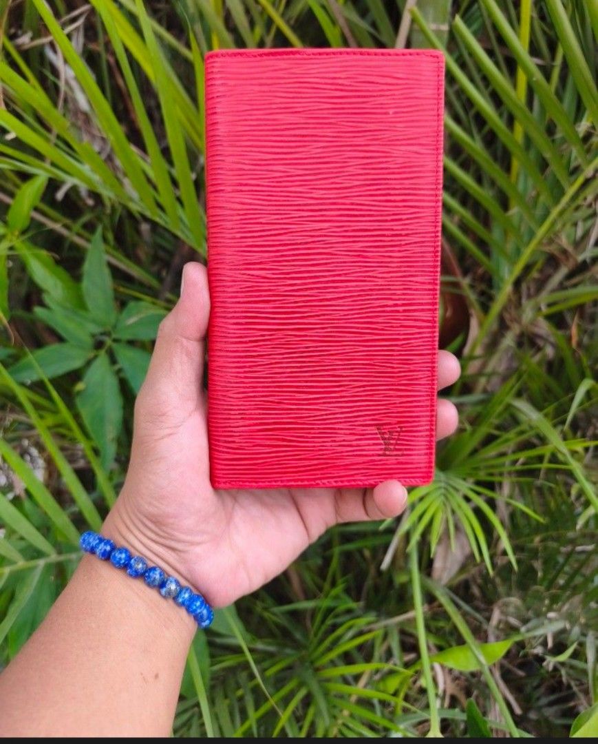 Louis Vuitton Red Epi Leather Wallet (Category: Luxury Bags & Wallets) located in Quezon City. Submitted by bybelaching (Listing ID 1438686619, Image 1). Description: Authentic Louis Vuitton wallet Red Epi leather Multiple card slots Bill compartment Red interior Made in France Iconic LV logo Stylish and functional FRESH FROM JAPAN SOURCE EXCELLENT CONDITION SIGN OF USAGE 1250 + SF DKO MAKITA CODE PERO NUNG PINOST KO, AUTOMATIC SA DESCRIPTION AUT