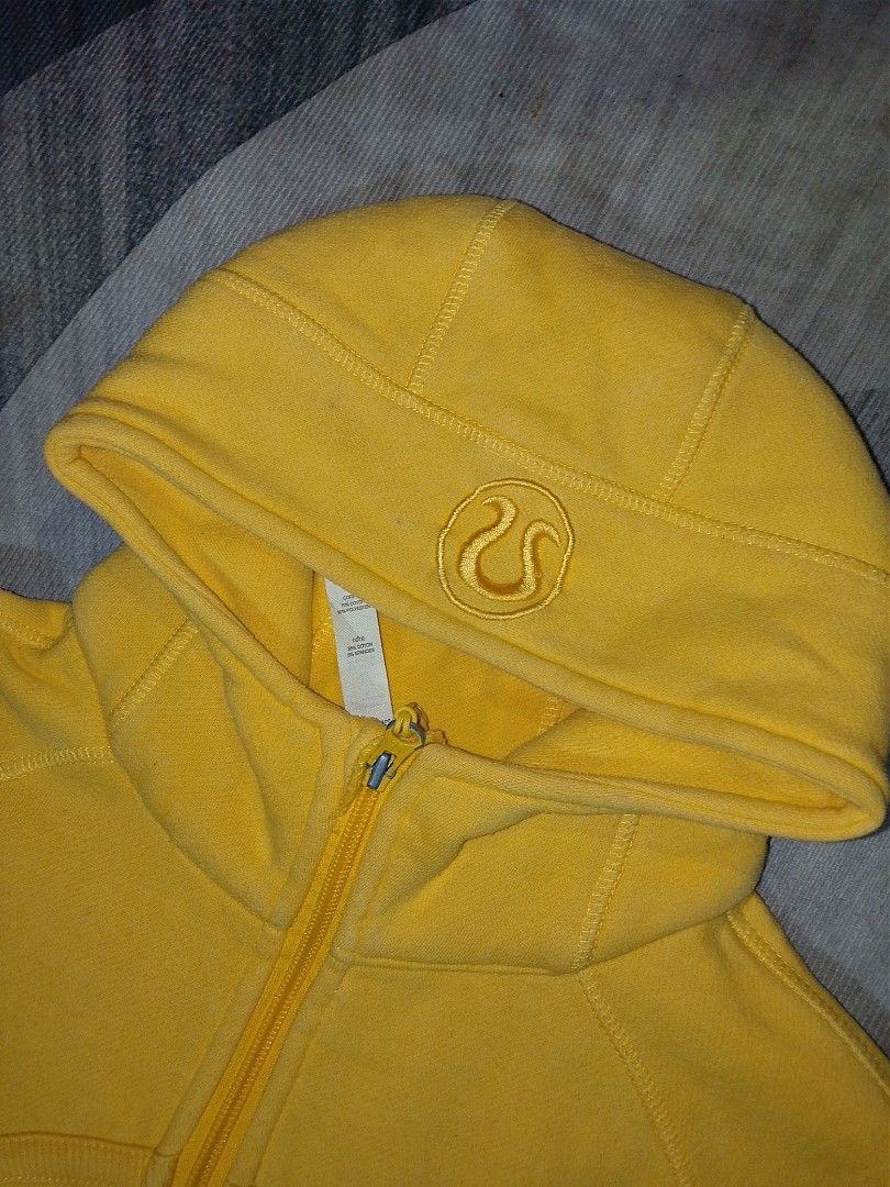 Lululemon Yellow Hoodie Jacket Size 8 (Category: Coats, Jackets and Outerwear) located in Bacoor. Submitted by luckyjohnsel (Listing ID 1438671566, Image 2). Description: - Lululemon hoodie in vibrant yellow - Size 8 - Full zip closure - Hood with Lululemon logo - Pockets - Thumb holes - Soft, comfortable fabric - Lululemon logo on zipper pull.