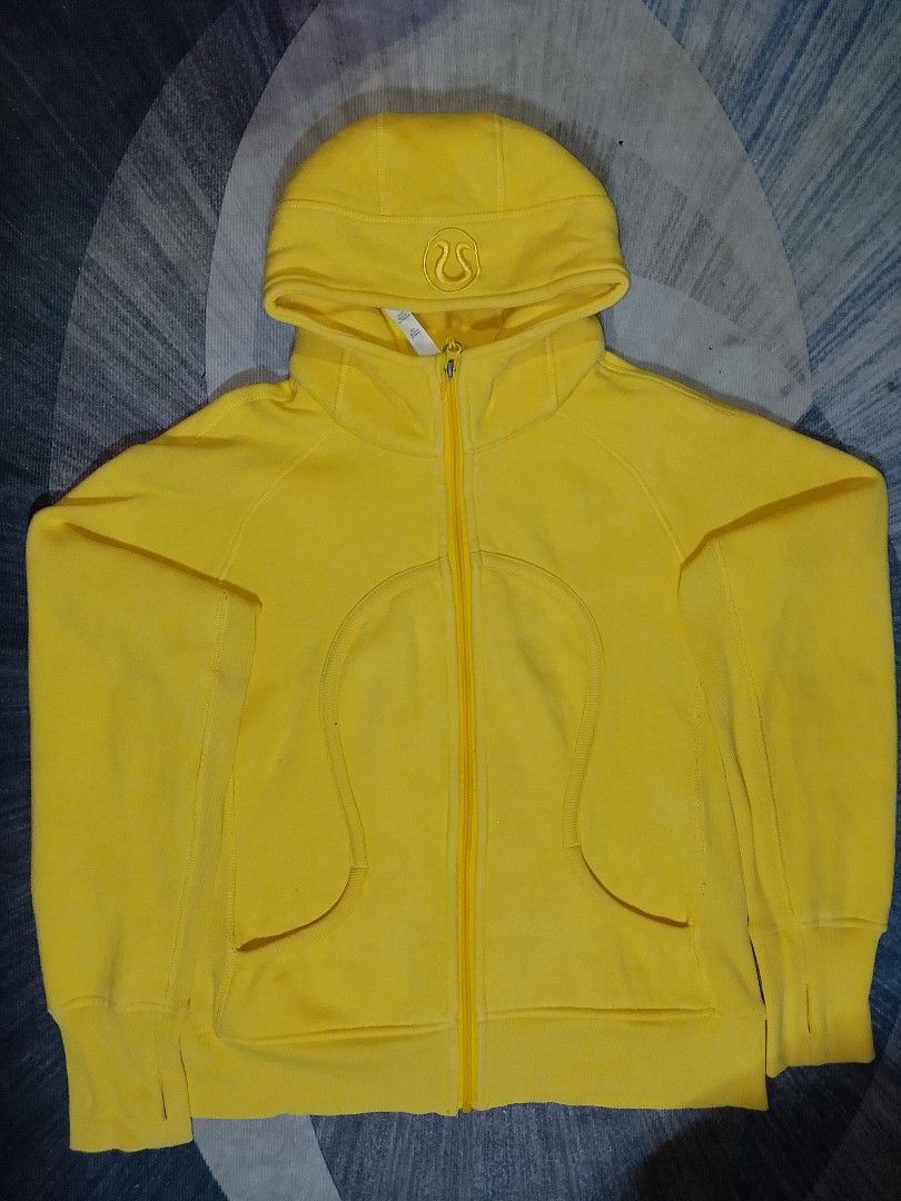 Lululemon Yellow Hoodie Jacket Size 8 (Category: Coats, Jackets and Outerwear) located in Bacoor. Submitted by luckyjohnsel (Listing ID 1438671566, Image 1). Description: - Lululemon hoodie in vibrant yellow - Size 8 - Full zip closure - Hood with Lululemon logo - Pockets - Thumb holes - Soft, comfortable fabric - Lululemon logo on zipper pull.