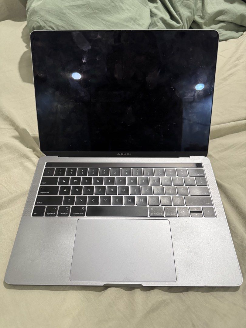 MacBook Pro 13-inch 2019 (Category: Laptops & Notebooks) located in Manila. Submitted by usuajsheole213311 (Listing ID 1438632765, Image 3). Description: - MacBook Pro 13-inch (Silver) - 1.4 GHz Quad-Core Intel Core i5 processor - 8GB 2133 MHz LPDDR3 memory - Intel Iris Plus Graphics 645 (1536 MB) - macOS Sequoia 15.7.5 - Two Thunderbolt 3 ports minor scratch.