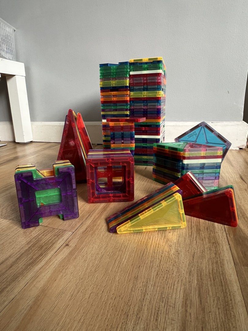 Magna-Tiles Clear Colors Set Picasso (Category: Educational & Learning Toys) located in Quezon. Submitted by smallville.ph (Listing ID 1438553671, Image 2). Description: - Magna-Tiles set with various shapes and colors. - Includes squares, triangles, and other geometric shapes. - Transparent and colorful tiles. - Encourages creative building and play. - Helps develop creativity and spatial reasoning skills..