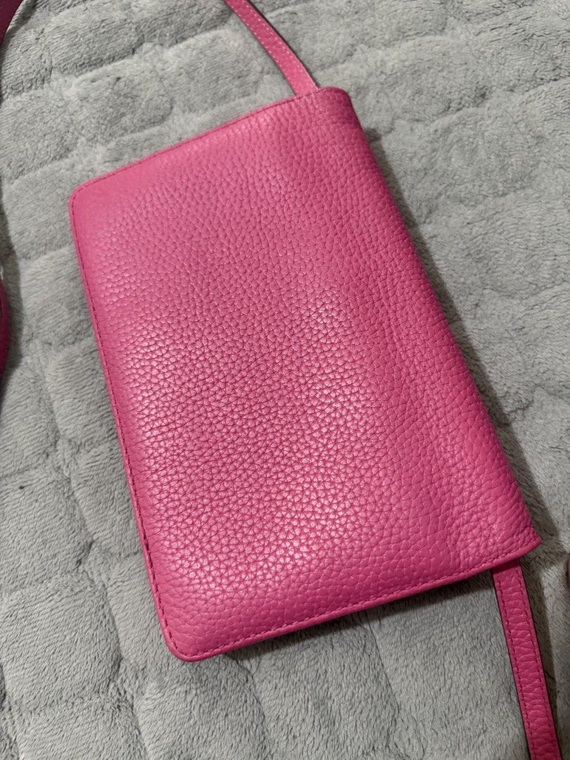 Marc Jacobs Gotham City SLGS leather (Category: Cross-body Bags) located in Quezon City. Submitted by vianca13 (Listing ID 1438536823, Image 2). Description: Marc Jacobs crossbody bag is a vibrant pink color. It features a zippered compartment and multiple card slots. The bag has a long strap for easy carrying. The interior is black..