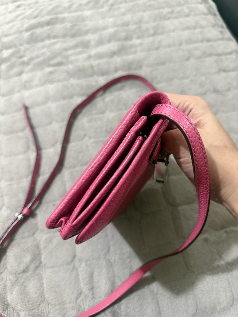 Marc Jacobs Gotham City SLGS leather (Category: Cross-body Bags) located in Quezon City. Submitted by vianca13 (Listing ID 1438536823, Image 3). Description: Marc Jacobs crossbody bag is a vibrant pink color. It features a zippered compartment and multiple card slots. The bag has a long strap for easy carrying. The interior is black..