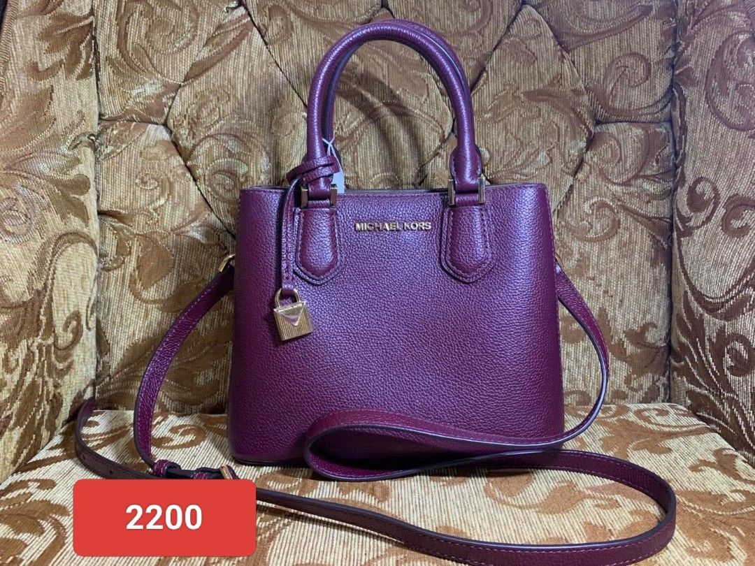 Michael Kors Satchel Bag (Category: Luxury Bags & Wallets) located in Manila. Submitted by jiainah (Listing ID 1438567955, Image 1). Description: - Michael Kors satchel bag - Color: Burgundy - Features: - Top handle - Detachable shoulder strap - Gold-tone padlock detail - Michael Kors logo - Structured shape - Includes tag.